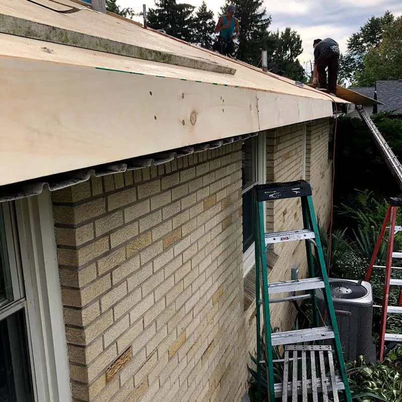 Tony and the Gold Construction crew working on a Grand Island roof