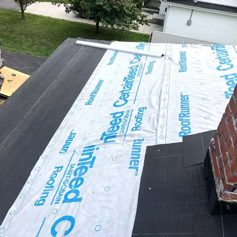 Tony inspecting a roof