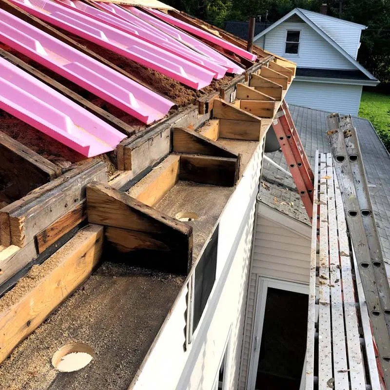 Seamless gutter installation on a residential home